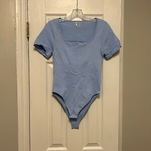 OQQ powder blue body suit.